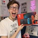 a soyboy is excited very much, he is a soy beta who shows off his new "Nintendo Switch" proudly for the social media post